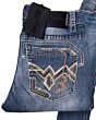 Close-up view of bold geometric embroidery on the back pocket of Montero 4623 light blue jeans.