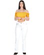 Full-length image of a woman in Danesi D828 White Boot Cut jeans paired with a yellow top, emphasizing the jeans' flattering silhouette.