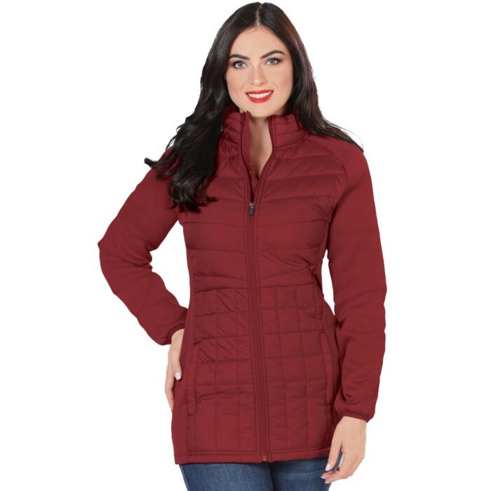 Front view of a woman wearing a burgundy long quilted jacket with a zipper