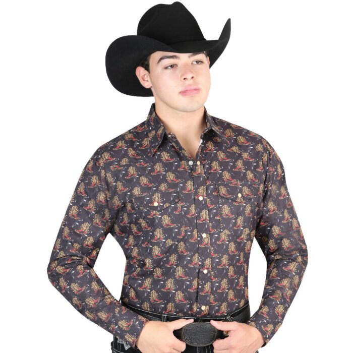 Man wearing a black Western shirt with cowboy boot print and a black cowboy hat.