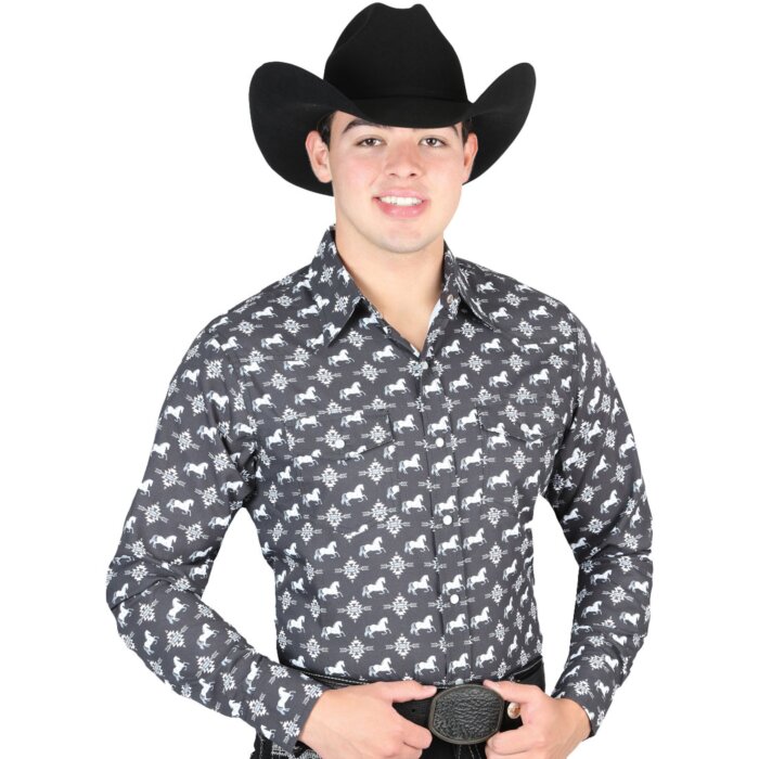 Man wearing a black Western shirt with white horse and Southwestern designs paired with a black cowboy hat.