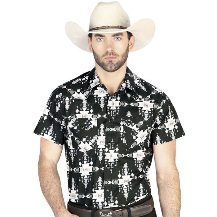 Man wearing a black short-sleeve Western shirt featuring intricate tribal-inspired geometric patterns in black and white with snap-button closure.