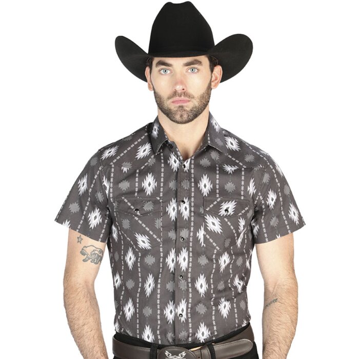 Man wearing a black short-sleeve Western shirt with an ikat-inspired geometric pattern and snap-button closure, perfect for summer cowboy style.