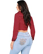 Back view of a woman wearing light blue boot cut jeans, highlighting detailed embroidered back pockets.