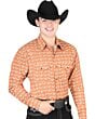 Man wearing an orange Western shirt with a repeating longhorn pattern and a black cowboy hat.