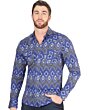 Man wearing a blue Western shirt with striking geometric patterns and a confident cowboy style.