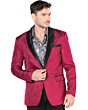 Hombre joven con barva rala luciendo saco rojo y camisa color gris.