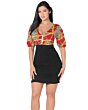 Model wearing a red dress with a gold geometric pattern top, front view.