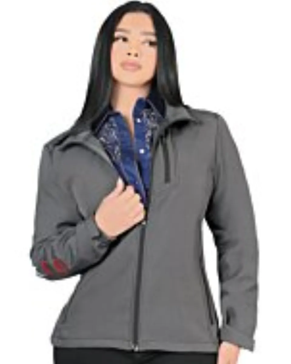 A woman wearing a gray softshell jacket with Mexico embroidery on the sleeve.