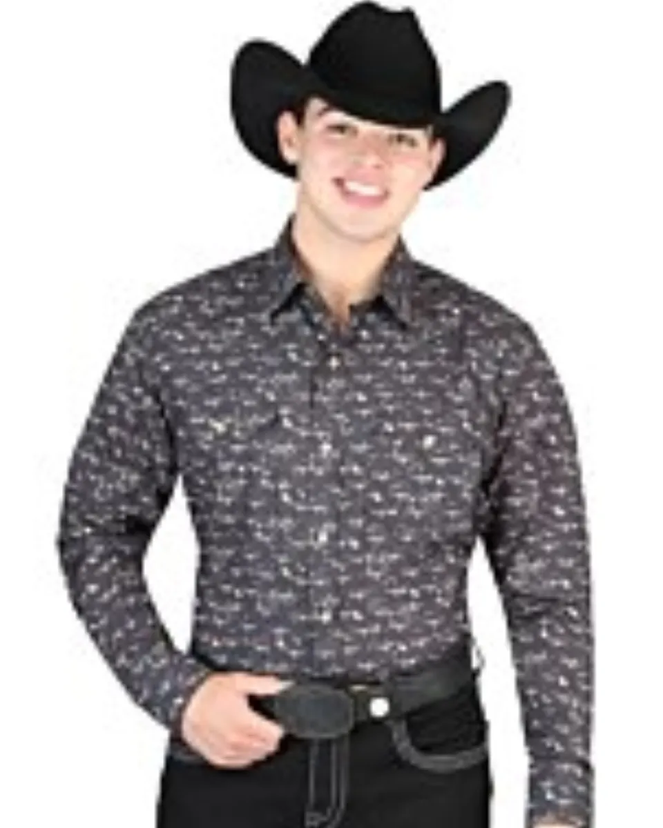 Man wearing a black Western shirt with longhorn skull print and a black cowboy hat.