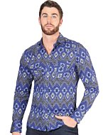 Man wearing a blue Western shirt with striking geometric patterns and a confident cowboy style.