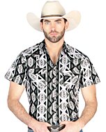 Man wearing a gray short-sleeve Western shirt with striking geometric patterns in black, white, and gray, featuring snap-button closure for a sharp cowboy look.