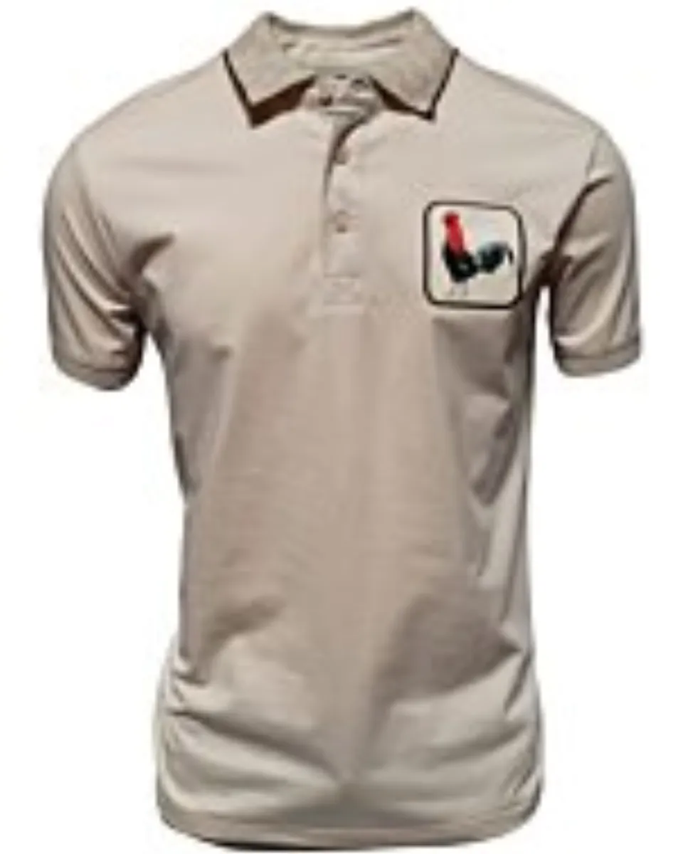 Camisa polo beige para caballero con un distintivo bordado de gallo, confeccionada en una mezcla transpirable de algodón y poliéster por Montero.